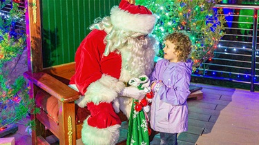 Santa Claus listens to girl