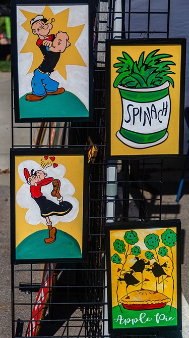 Popeye and spinach signs