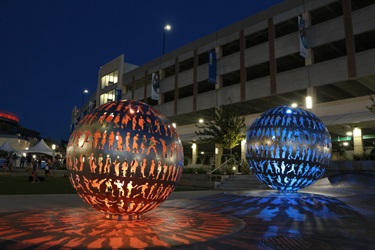 Body Politic sculptures. Body Politic: Two stainless steel orbs celebrate a sense of community and the value of making personal connections in public spaces. Located on Lenexa's civic campus. Created by artist Joe O'Connell.