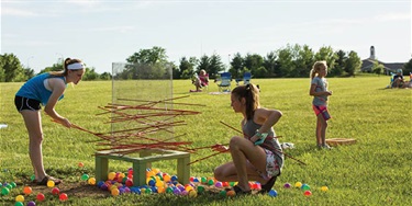 Kids playing yard games at a Movie in the Park. Photo by Lauren Walke.