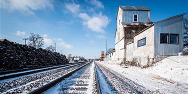 Railroad tracks covered in snow in Old Town Lenexa. Photo by Leigh Mitchell.