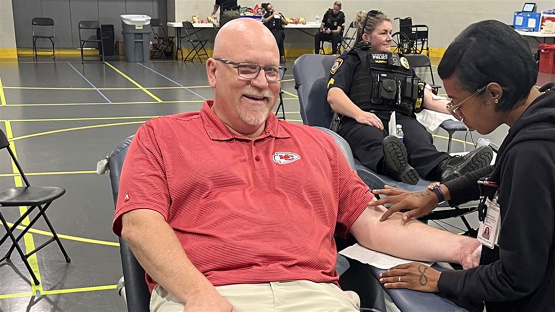 smiling man donating blood