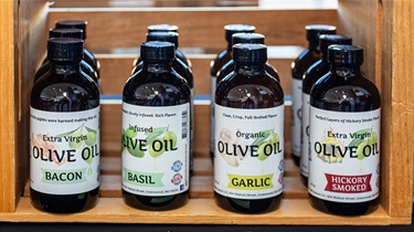 Close-up view of flavored olive oils in bottles