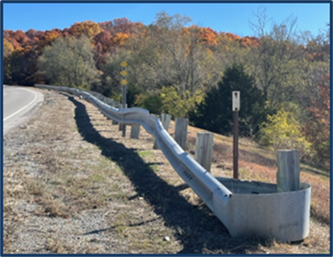 View of damaged guardrail on side of road