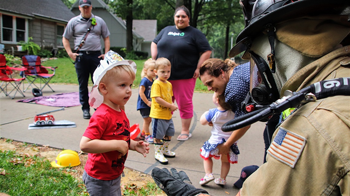 Firefighter talking with preschoolers