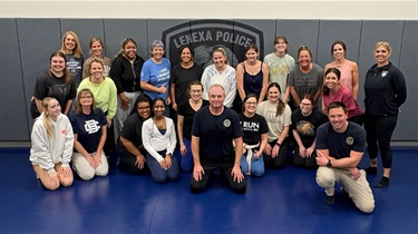 Group photo of more than 20 women who participated in women's self-defense workshop