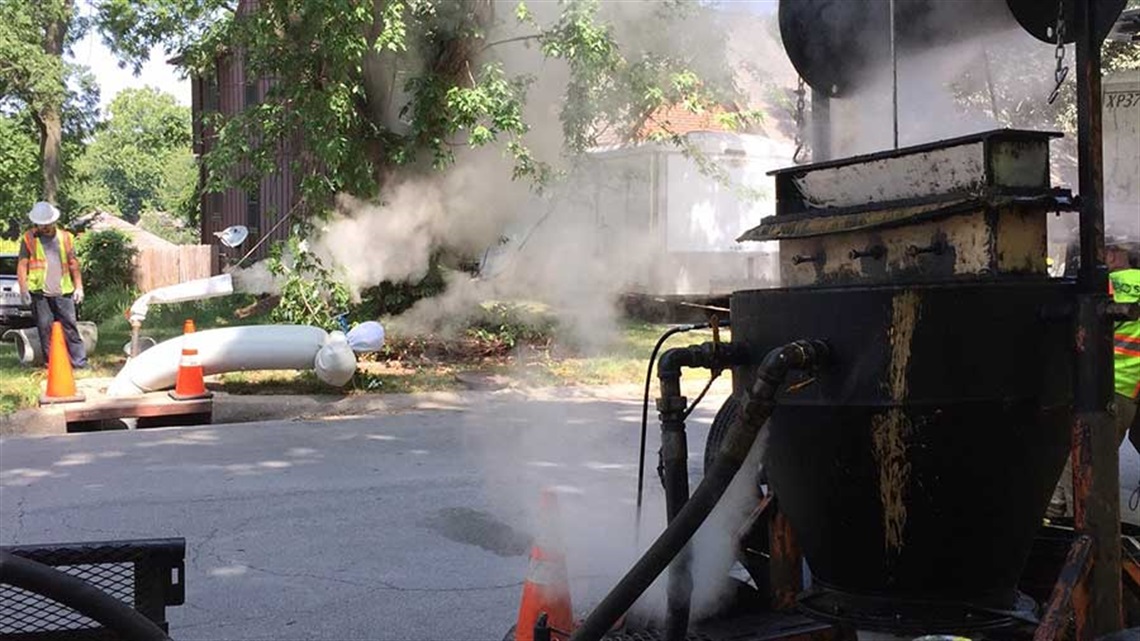 Steam coming off of pipe being fixed