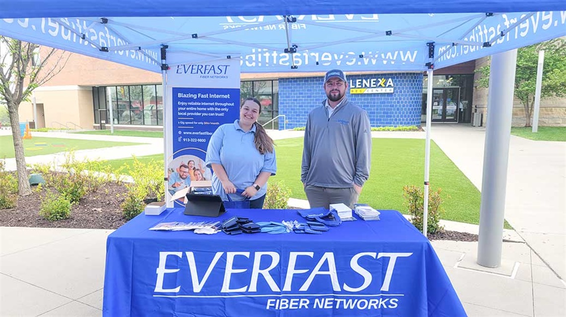 woman and man at EverFast Fiber Networks sponsor booth