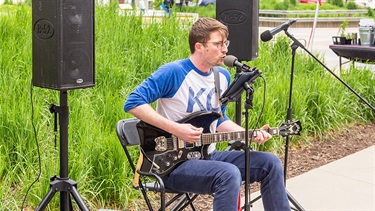 Musician performing with guitar