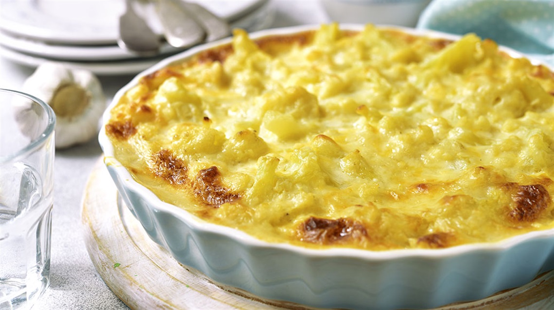 Cauliflower crustless quiche in white fluted dish