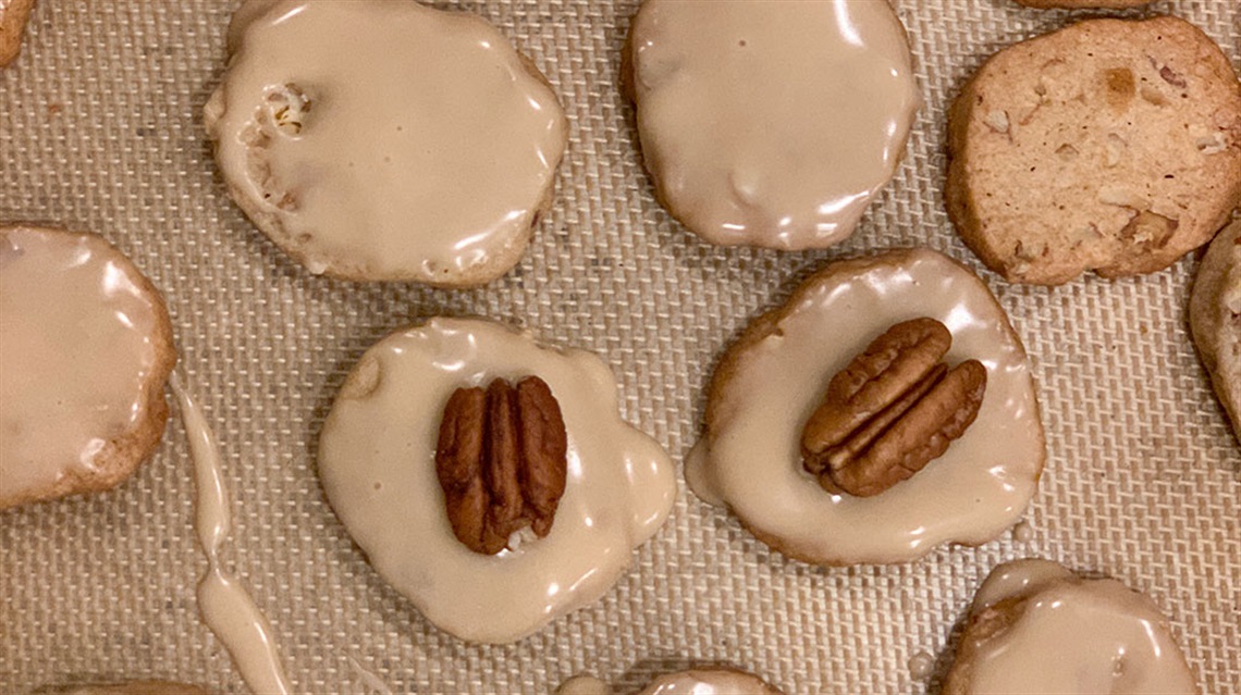 Aerial view of glazed honey pecan cookies on tray