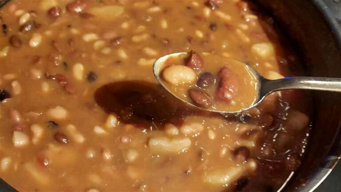 bowl of ham and bean soup with spoon