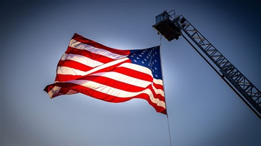 American flag hanging from fire truck