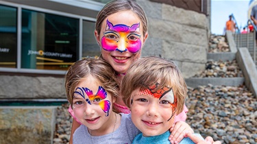 Three kids with painted faces