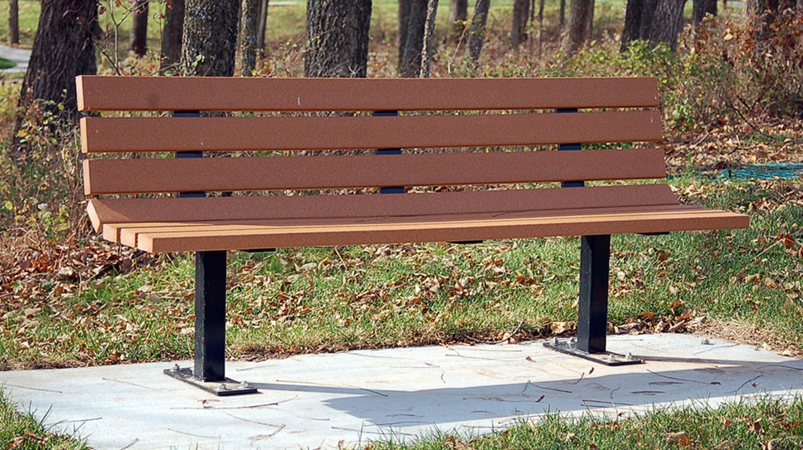 park bench anchored in concrete at a park