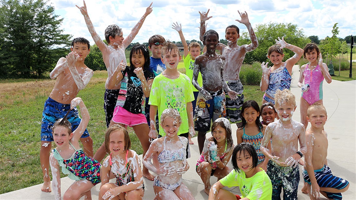 summer camp kids posing in swimsuits