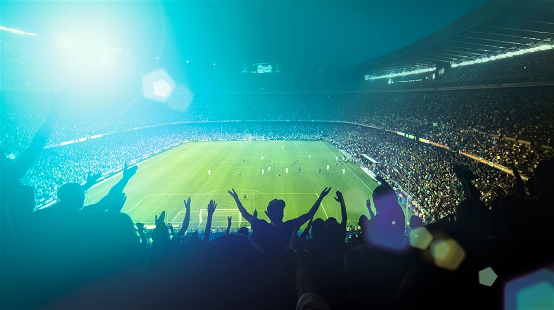 Nighttime view of soccer stadium full of fans