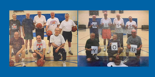 Mens senior basketball with signs