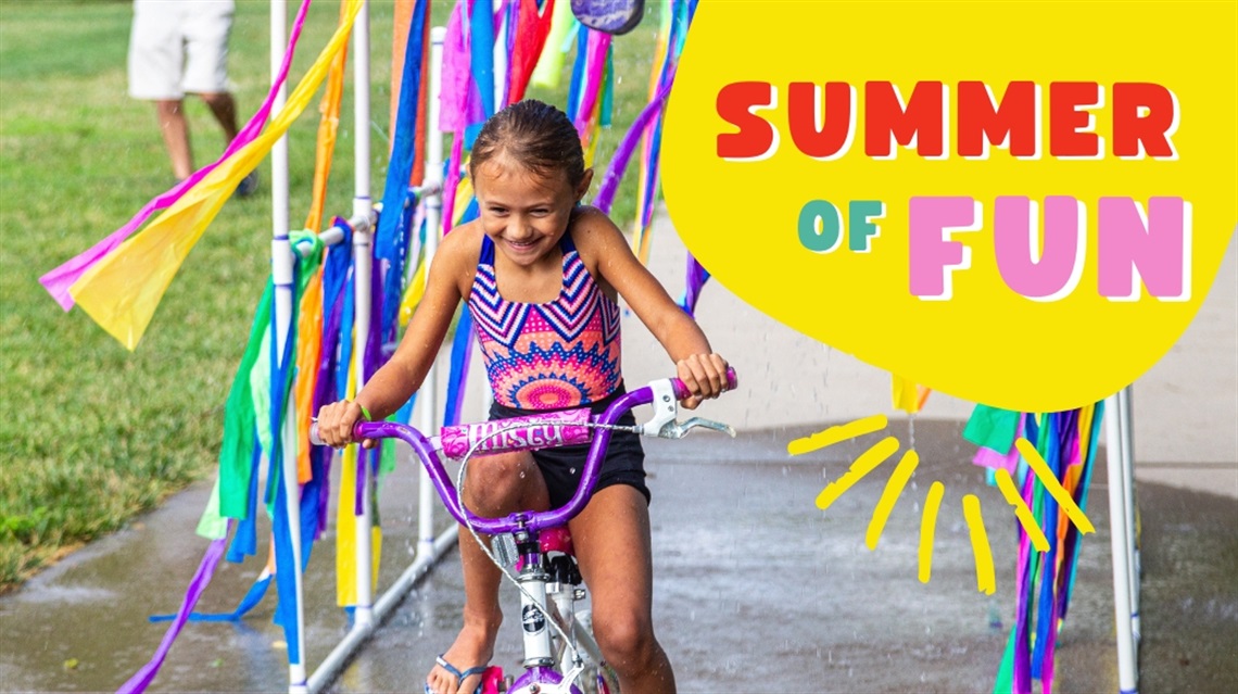Summer of Fun text next to girl riding bike through makeshift car wash