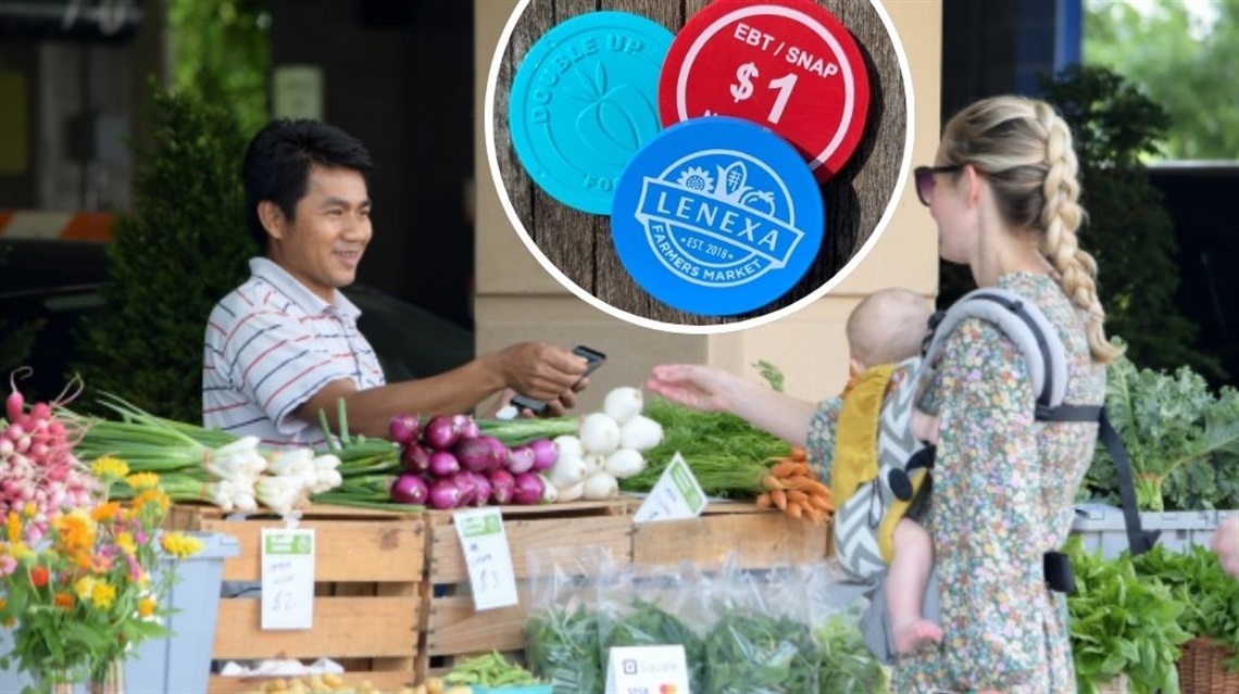 Woman paying male vendor for produce at Farmers Market with image of three tokens overlaid on top.