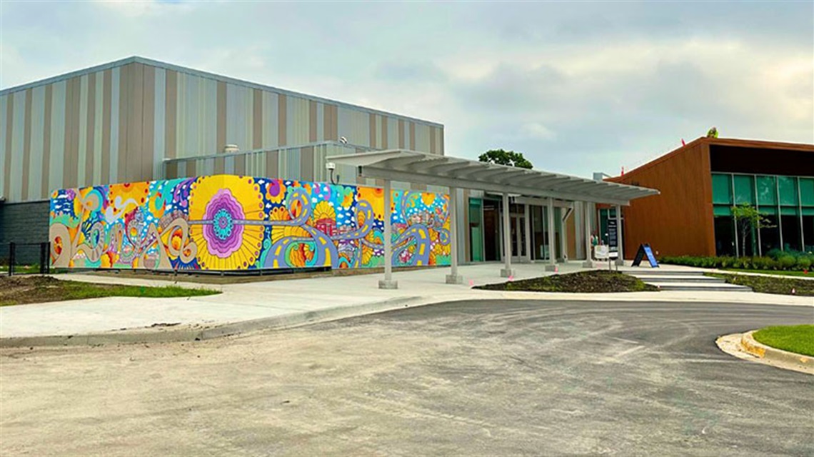 View of colorful mural painted on side of Lenexa Old Town Activity Center