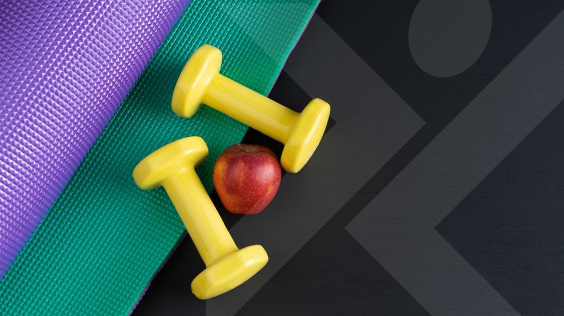 Yoga mats, apple and weights