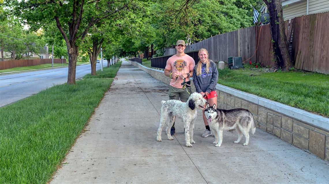 man and woman with two dogs posing on Lackman Trail