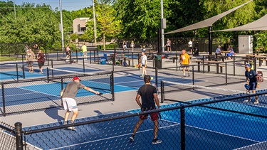 People playing on pickleball courts
