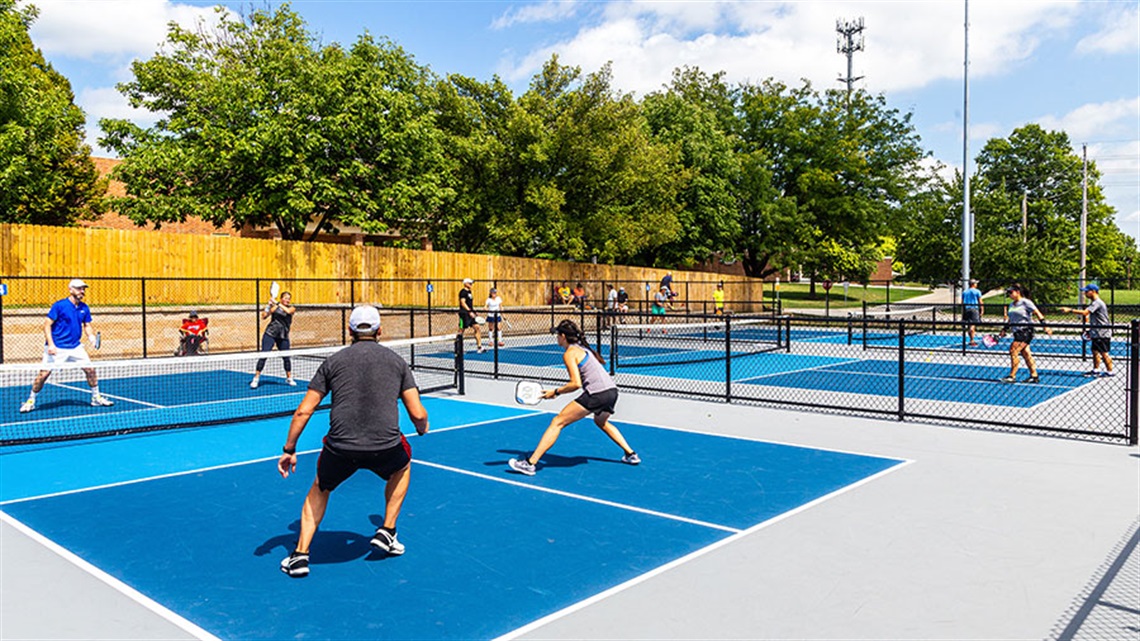 People playing on pickleball courts