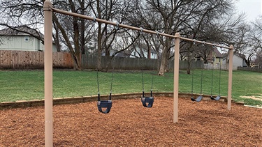 Bois D'Arc Park playground swings