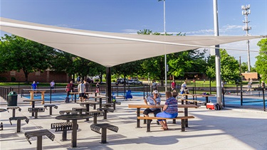 Pickleball complex shade structure with seating