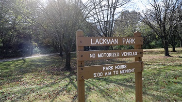 Park sign with trees