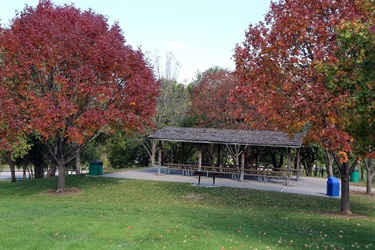 Park shelter amid trees in fall foliage