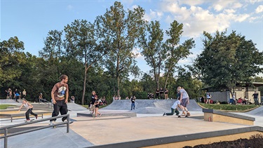 Wide view of skaters at Rolling Magic Skate Park