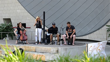 Musicians perform on outdoor stage