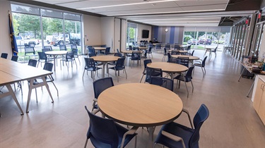 North and south sections of room facing southeast, with tables and chairs set up
