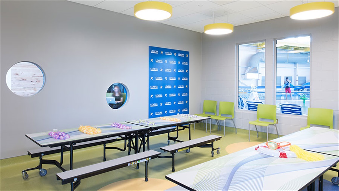 picnic-style tables inside party zone room