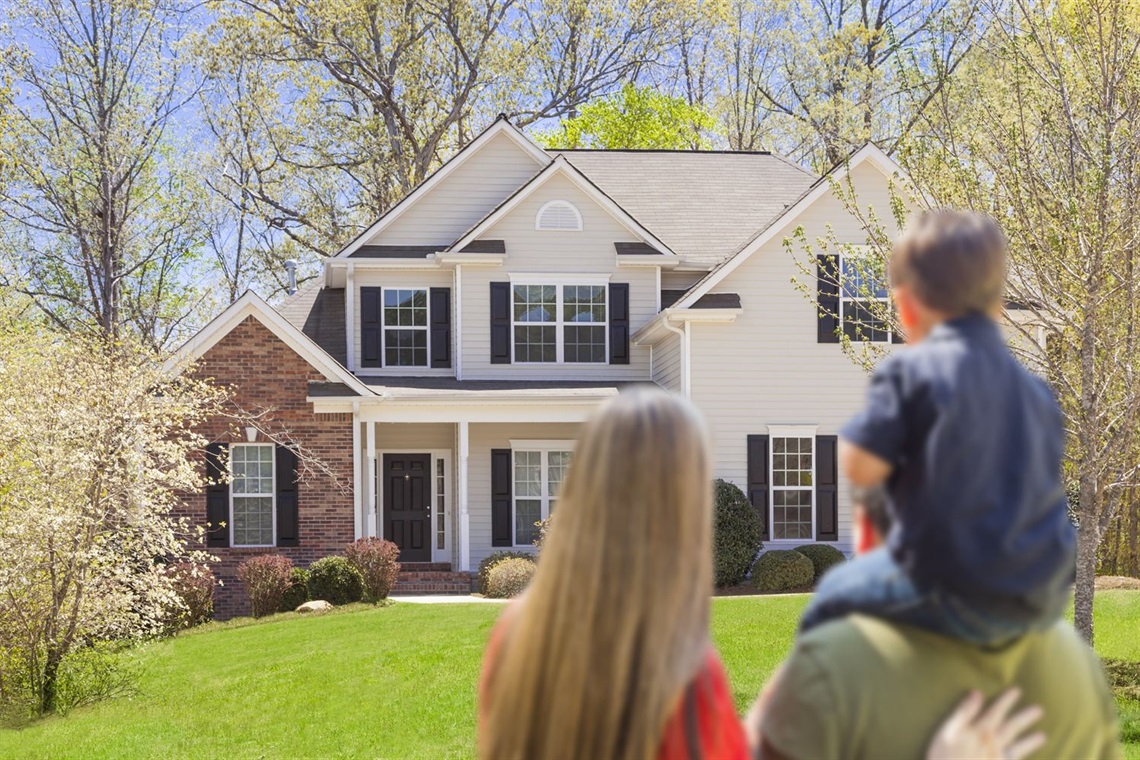 Family looking at their home