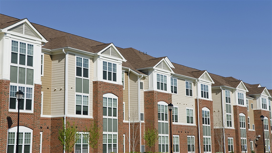 Three story apartment building