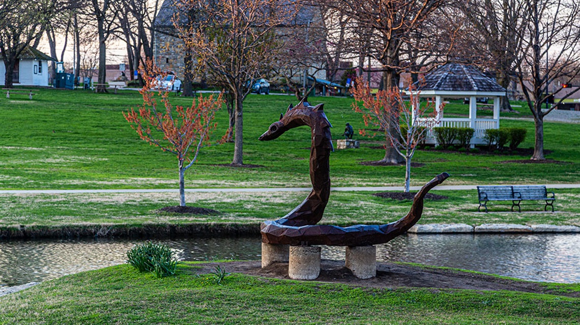 The Serpent and Swimmer public art sculptures in pond
