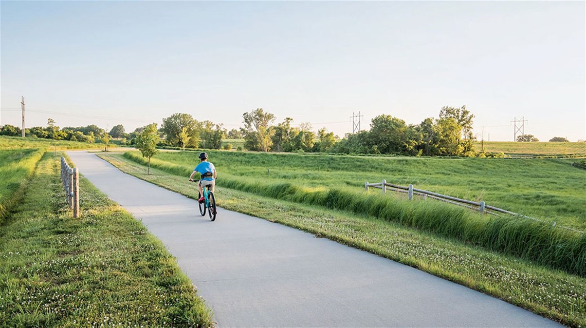 cyclist riding on trail