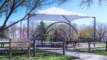 Electric Park playground with shade structure