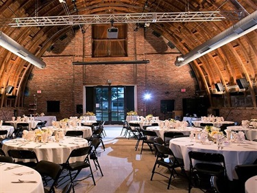 Main hall set for banquet with round tables