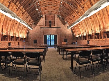 Main hall set with tables and chairs classroom style