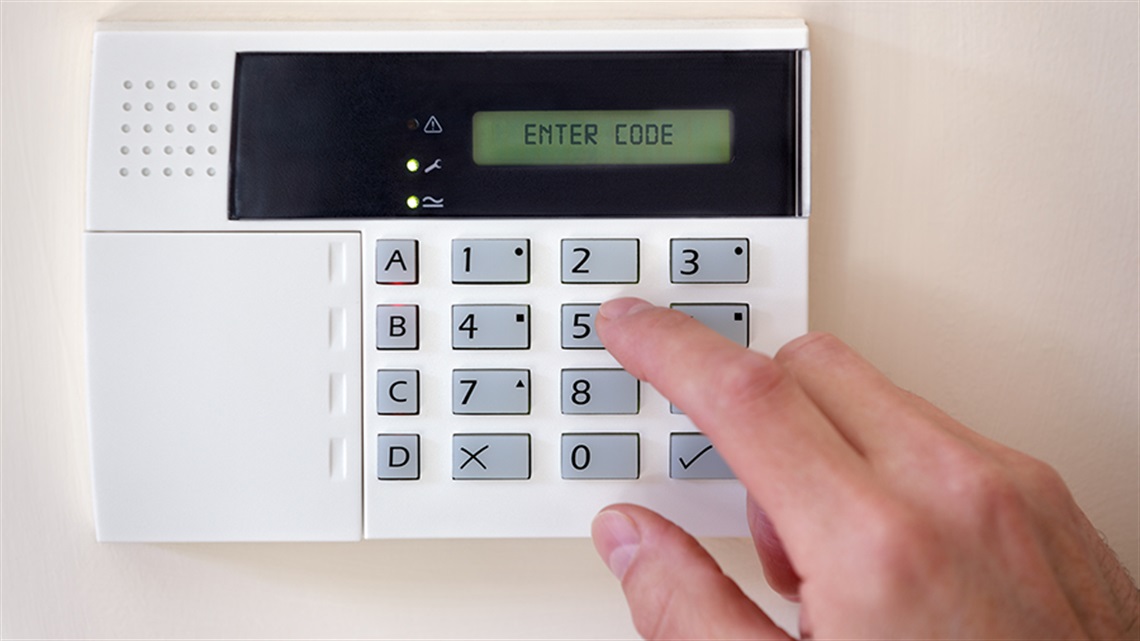 alarm keypad with finger entering code