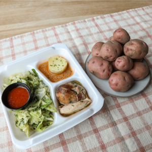 Braised chicken, potatoes and sautéed cabbage made by African Dream Cuisine