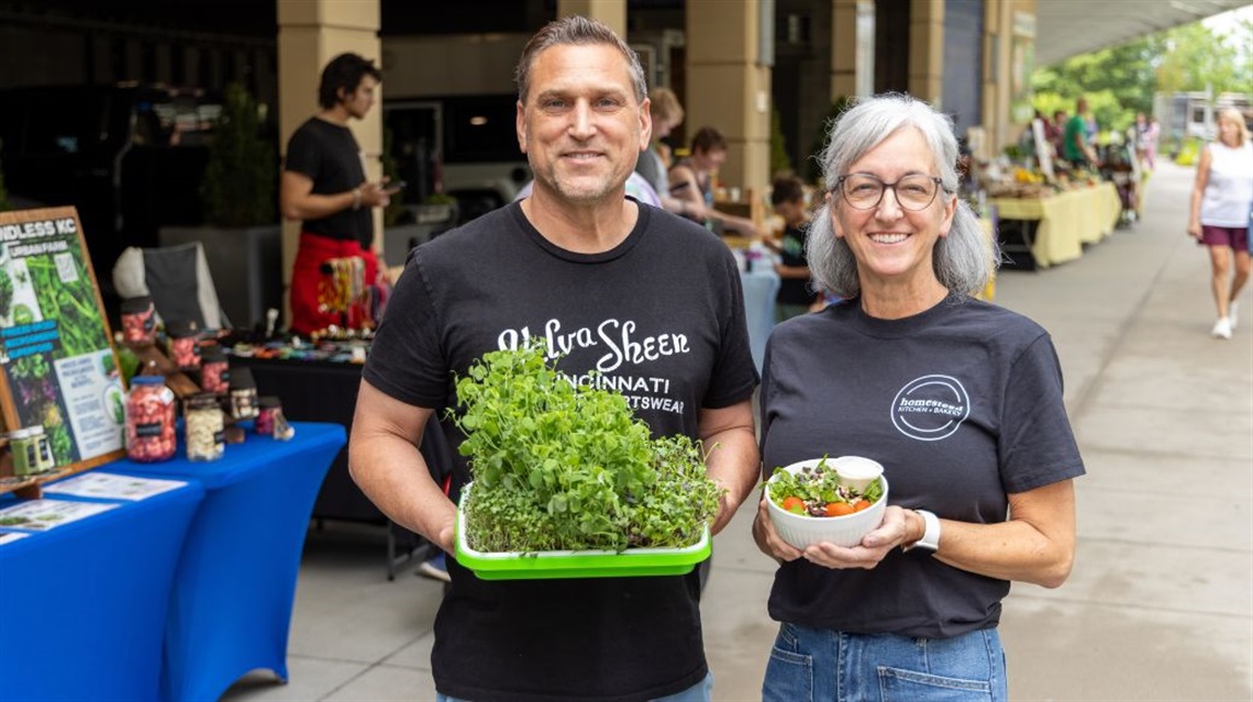 Farmers Market vendor with microgreens and Public Market merchant with salad in bowl
